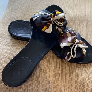 Black Gucci flats with fabric bow detail